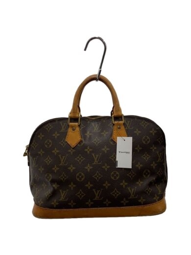 Brown monogram canvas bag with tan leather handles and base hanging from a hook, with a white tag attached.