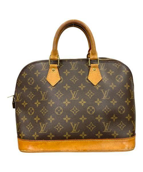 Front view of a brown monogram handbag with two top handles, a zipper, and tan leather trim.