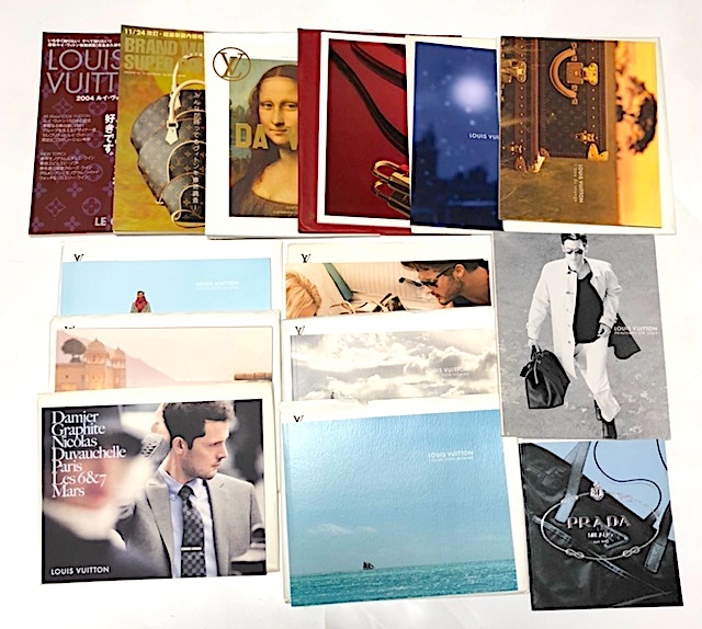 Multiple Louis Vuitton and Prada photocards and catalog-style cards arranged on a white background.