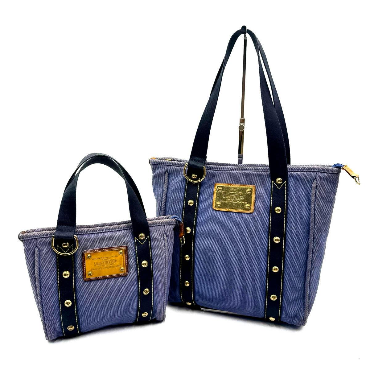 Two Louis Vuitton Antigua canvas tote bags (Cabas PM and Cabas MM) shown side by side on a white background.