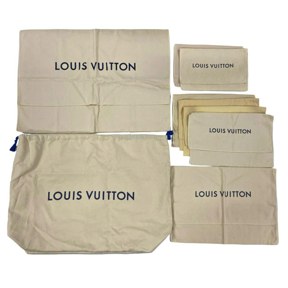 Several beige Louis Vuitton cotton dust bags and pouches arranged flat showing the LOUIS VUITTON logo.