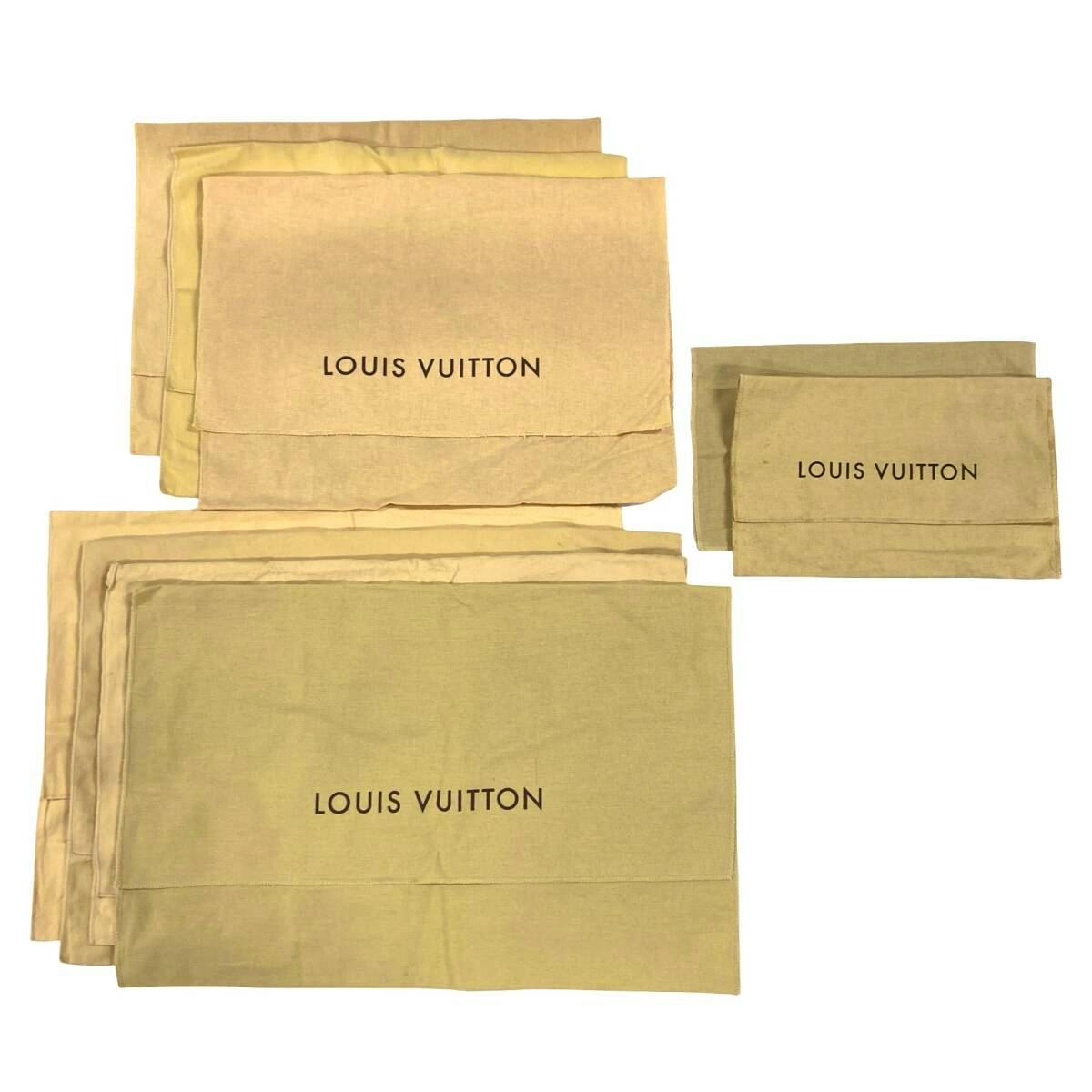 Beige Louis Vuitton storage/dust bags arranged flat, two showing the LOUIS VUITTON logo.