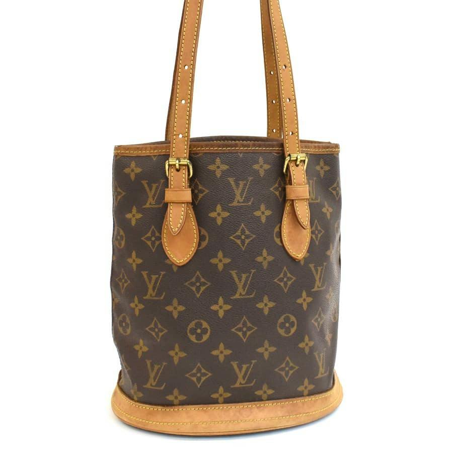 Front view of the Louis Vuitton monogram canvas Bucket PM tote bag with leather trim and shoulder straps.