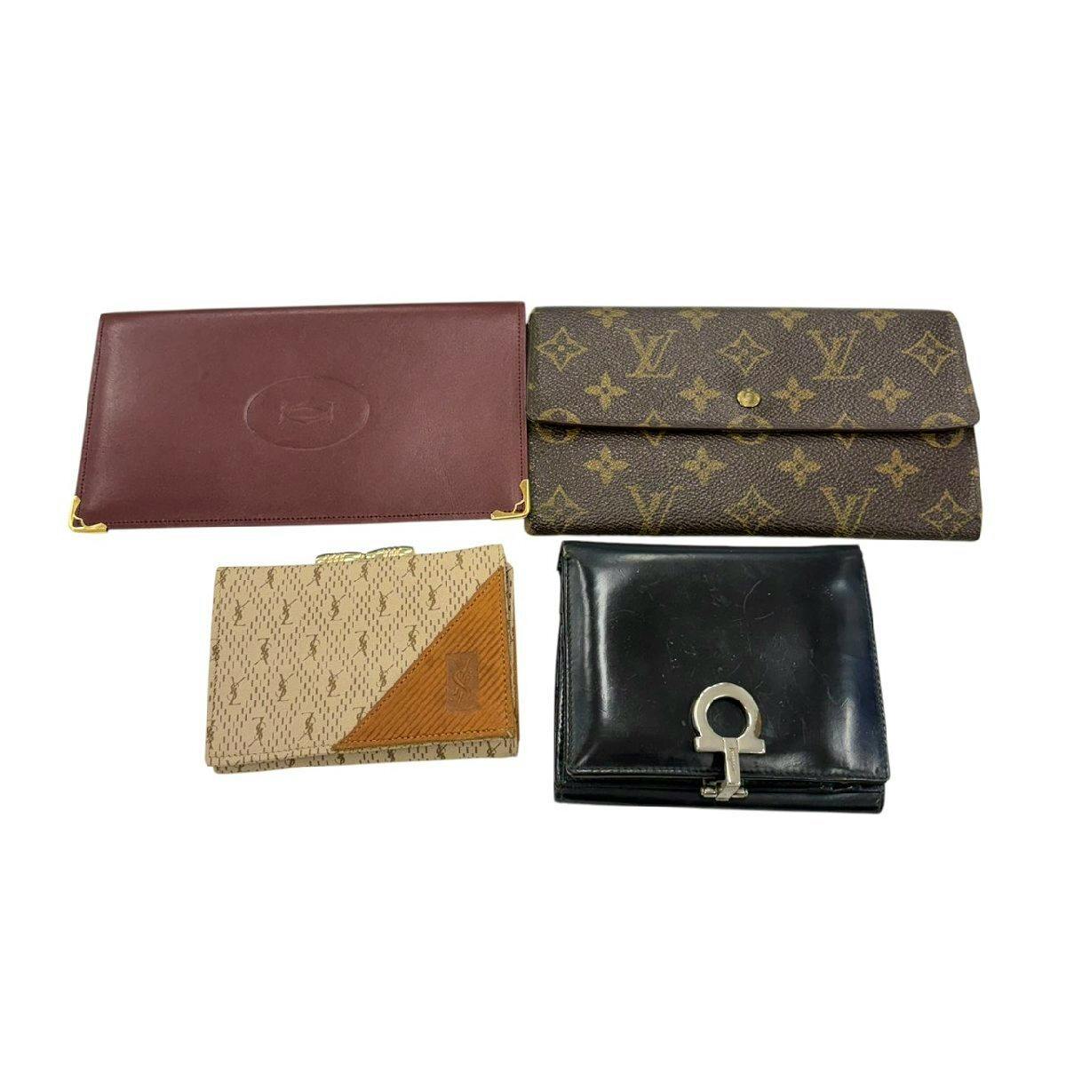 Four small wallets and cardholders, including a Louis Vuitton monogram long wallet, arranged on a white background.