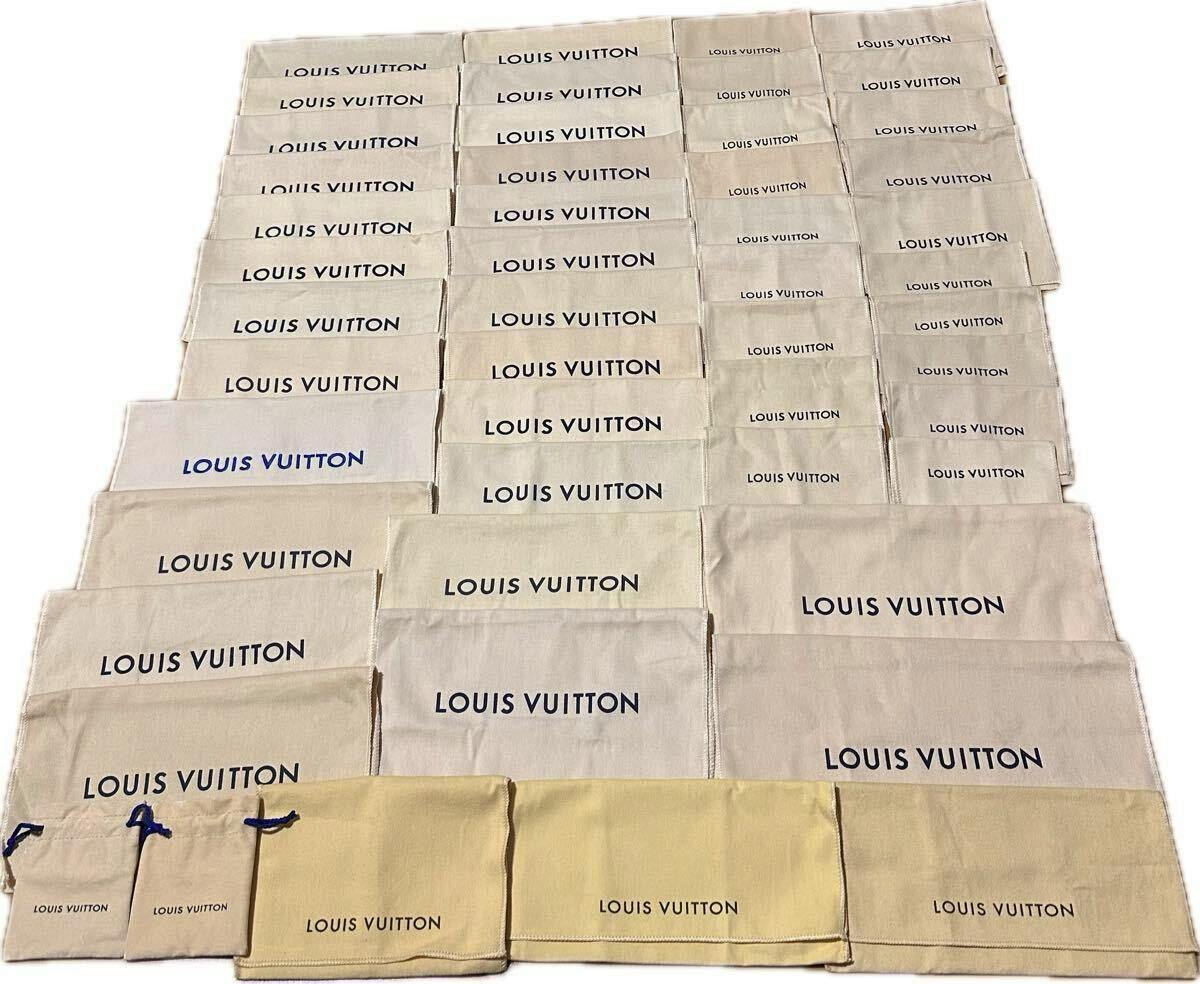 Large arrangement of Louis Vuitton cotton dust bags (50-piece set) laid out in rows, each printed with the "LOUIS VUITTON" logo.
