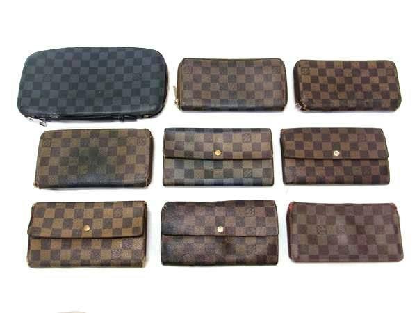 Nine Louis Vuitton Damier-pattern wallets and a pouch arranged on a white background.