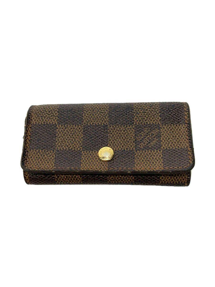 Closed brown Damier Ebene Louis Vuitton key case showing checkered exterior and gold snap button.