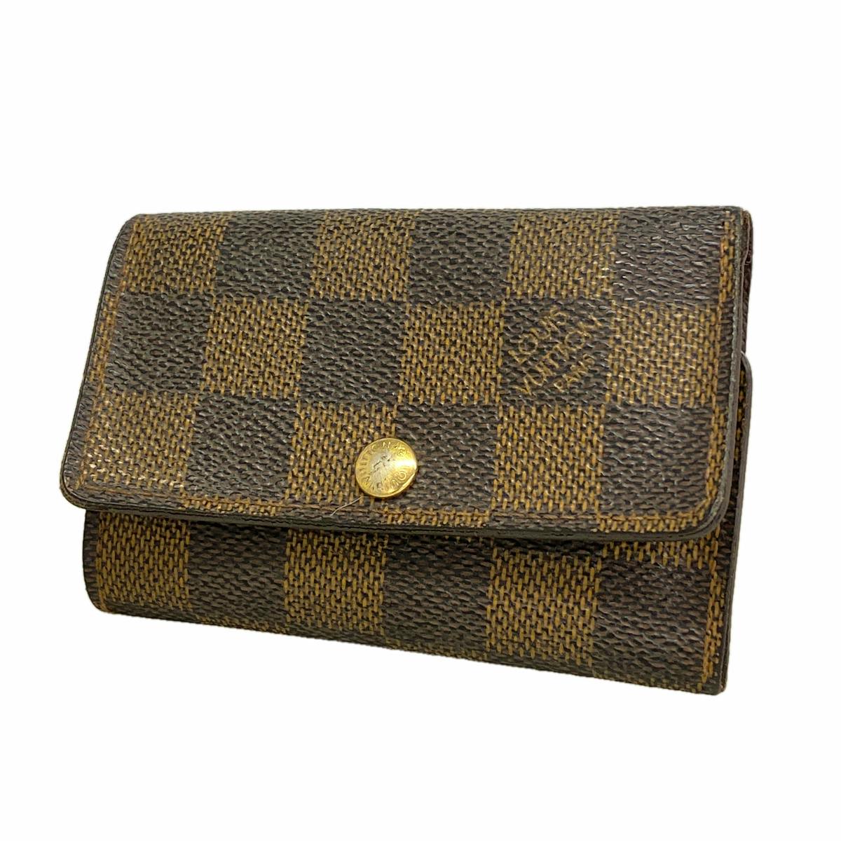 Louis Vuitton Damier Ebene Multiclé 6 canvas key case showing the front flap and gold snap button.