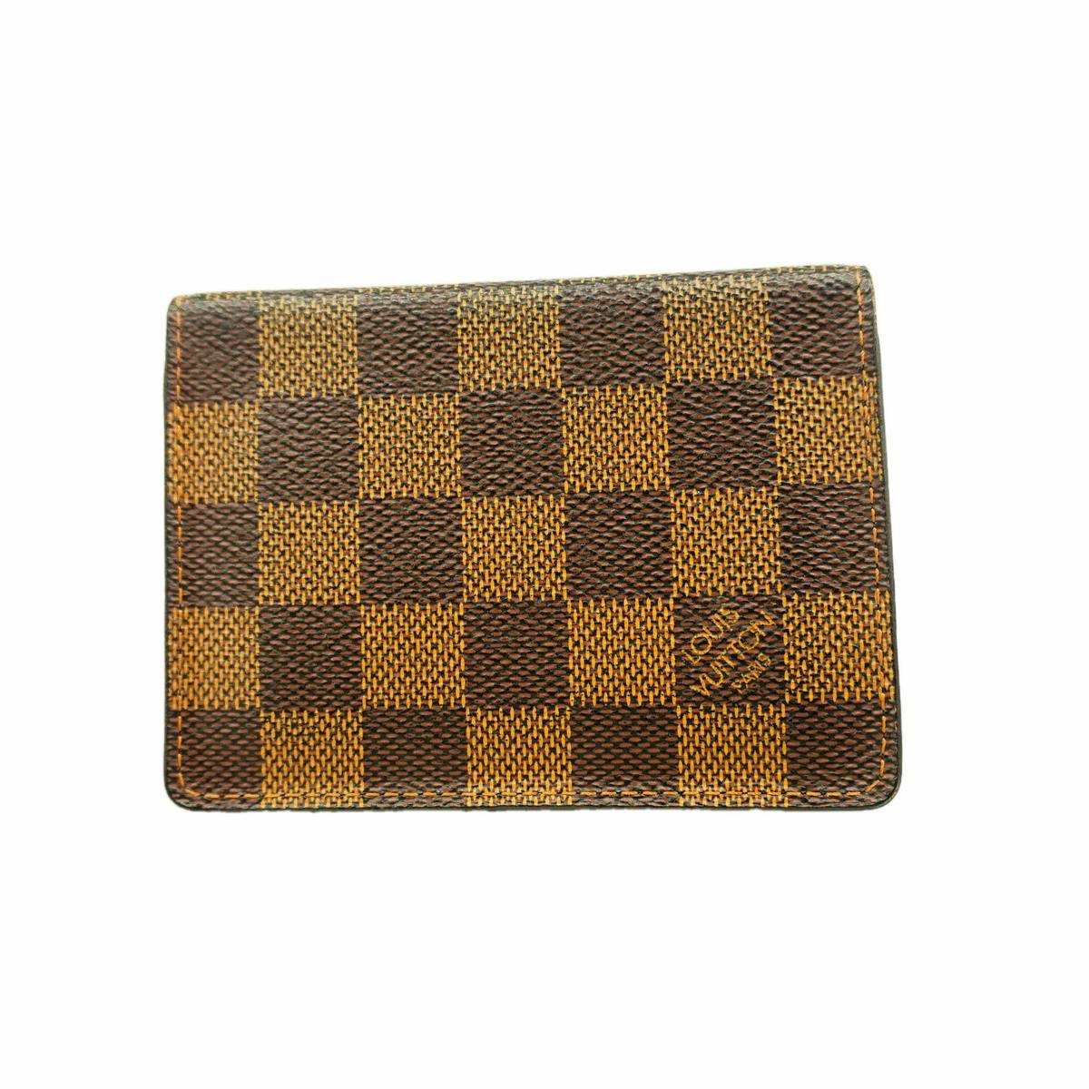 Louis Vuitton Damier Ebene canvas card case showing the checkered pattern on the exterior.