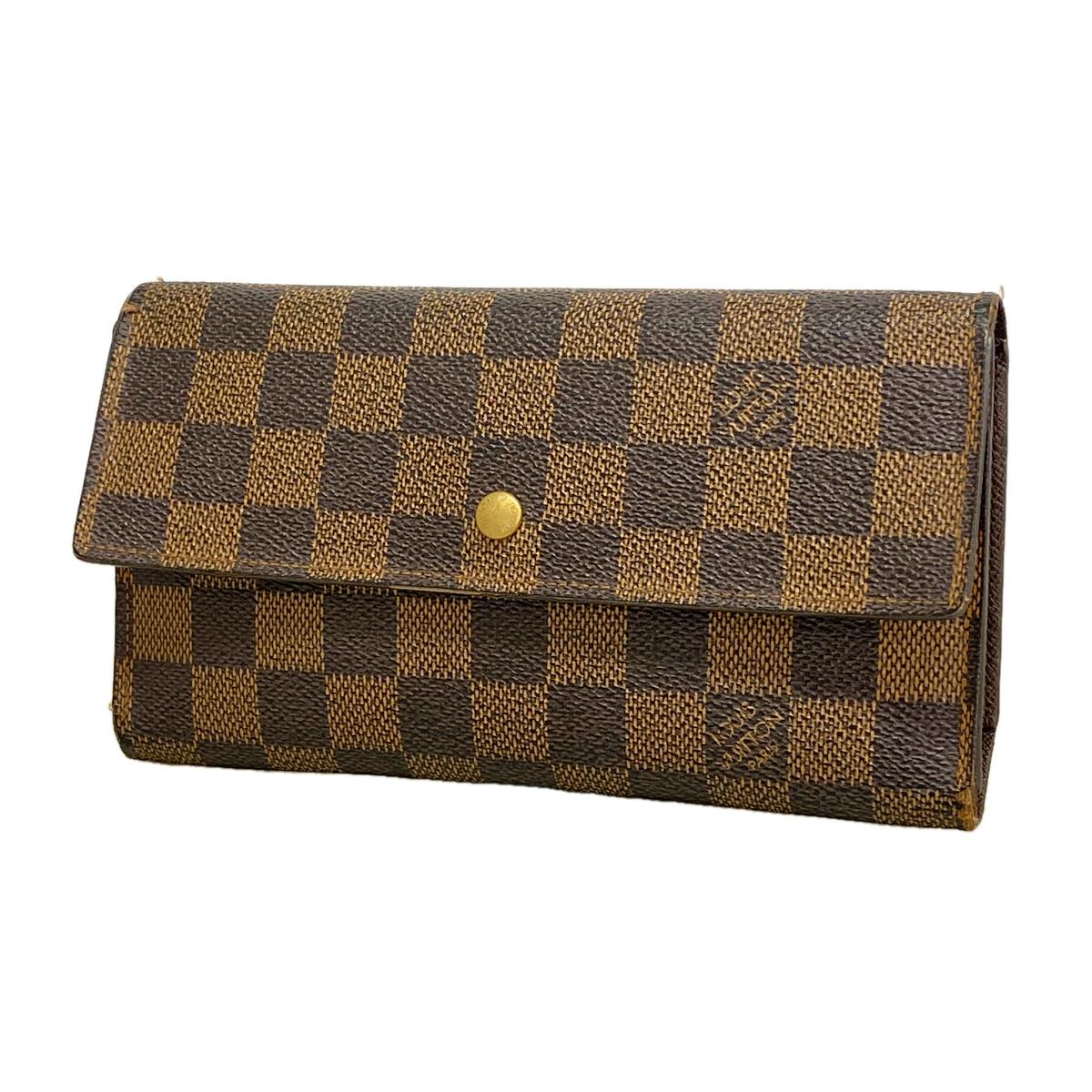 Louis Vuitton Damier Ebene canvas tri-fold long wallet shown closed with a flap and a gold snap button.
