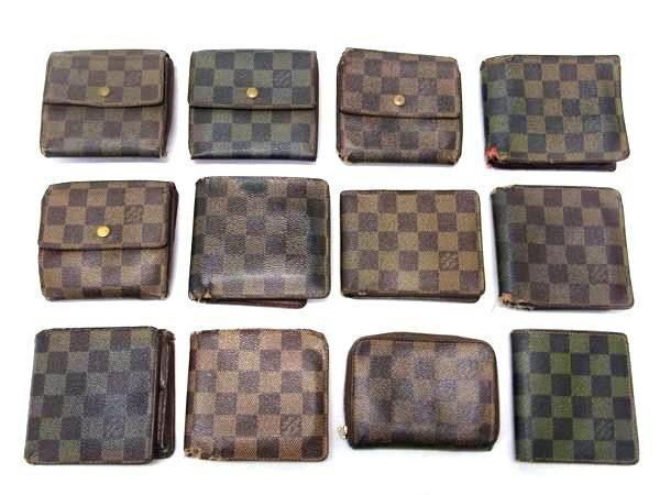 Twelve Louis Vuitton Damier-pattern small wallets and coin cases arranged in rows on a white background.
