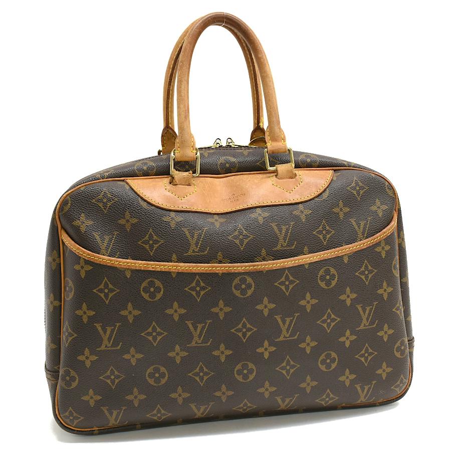 Front view of the brown Louis Vuitton monogram handbag showing its leather handles and exterior monogram canvas.