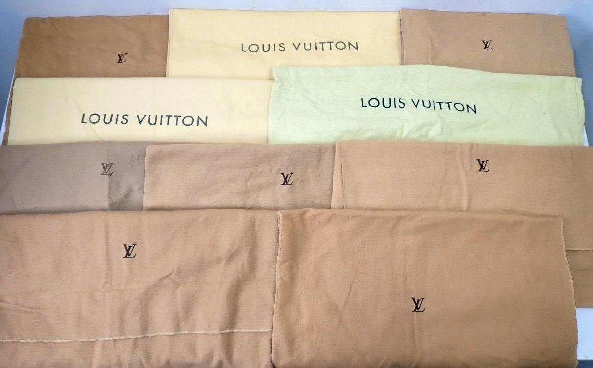 Ten Louis Vuitton fabric dust bags of various sizes laid flat, showing "LOUIS VUITTON" text and LV logos.