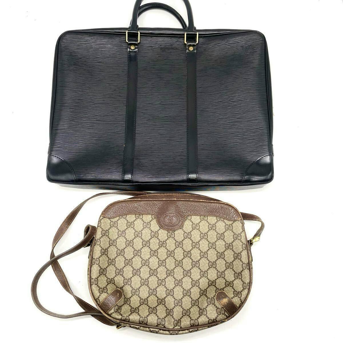 A black LOUIS VUITTON Epi business bag and a brown GUCCI GG monogram shoulder bag displayed on a white background.