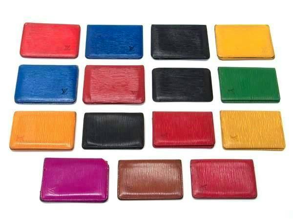 Fifteen Louis Vuitton Epi leather card/pass cases in various colors arranged in rows on a white background.