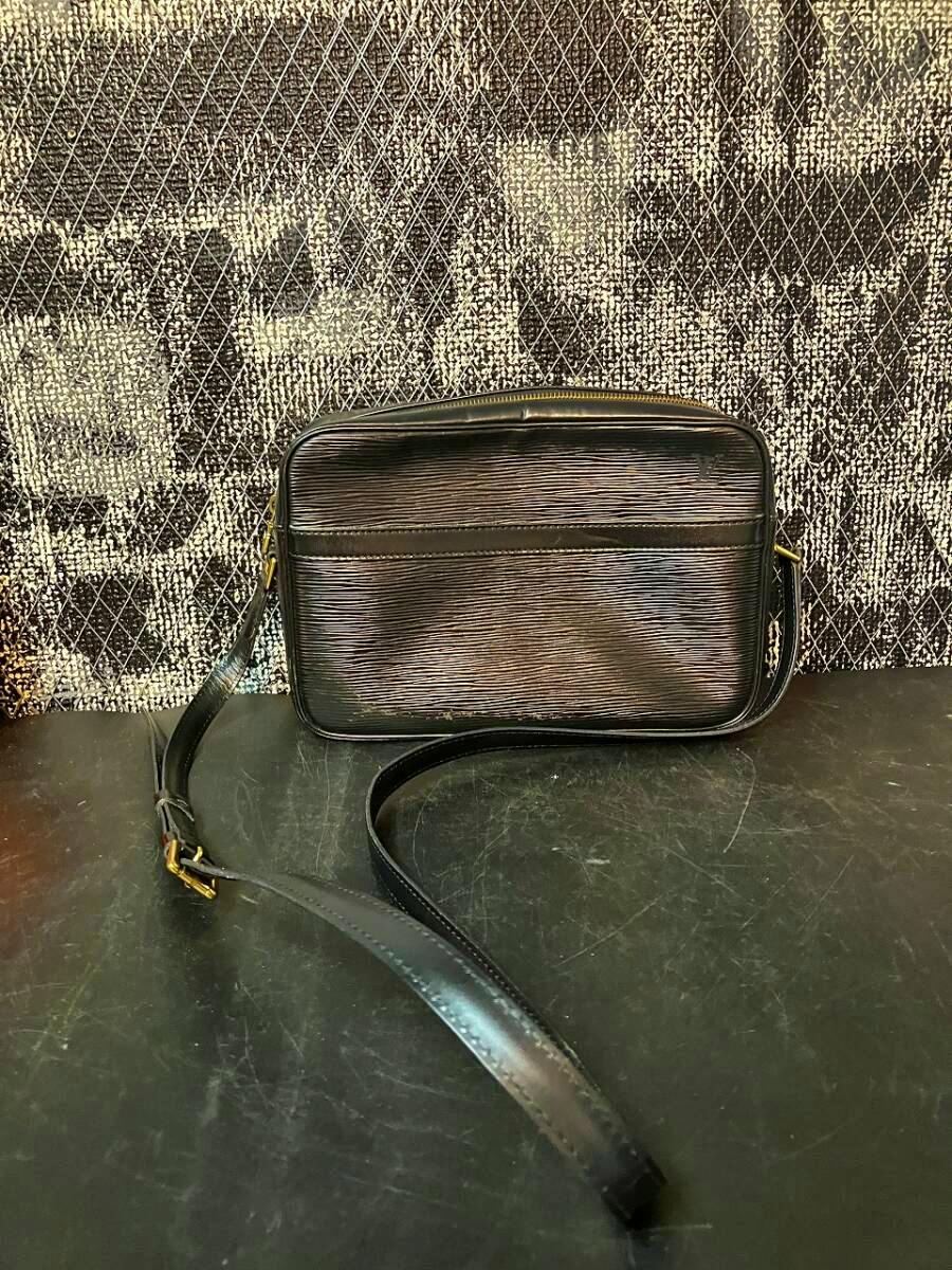 Black Louis Vuitton Epi leather crossbody pouch-style shoulder bag shown front-facing with its adjustable strap visible.