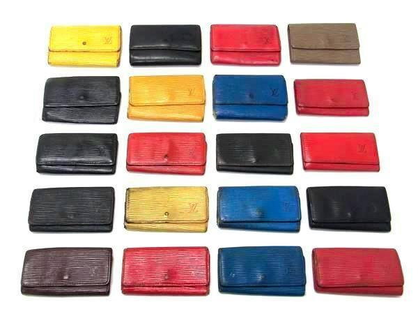Twenty Louis Vuitton Epi leather key cases in various colors arranged on a white background.