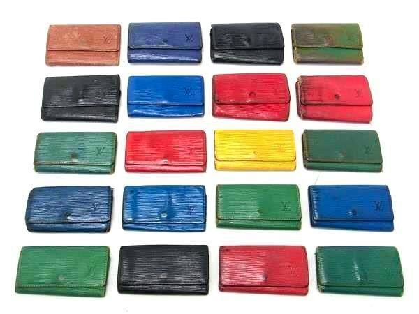 Twenty Louis Vuitton Epi key cases in various colors arranged in rows on a white background.