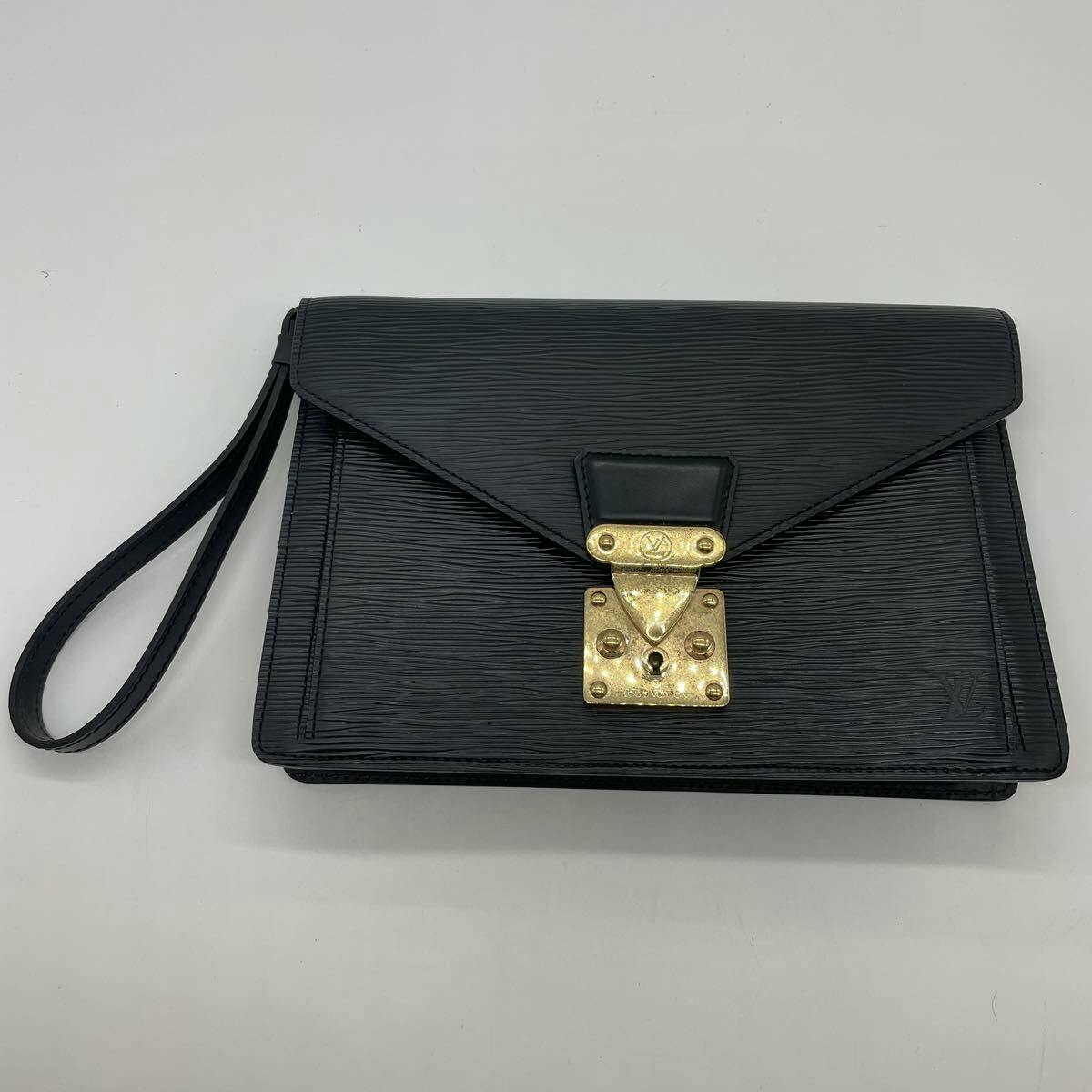 Black Louis Vuitton Epi Pochette Serie Dragonne clutch bag with wrist strap and gold-tone lock on a white background.