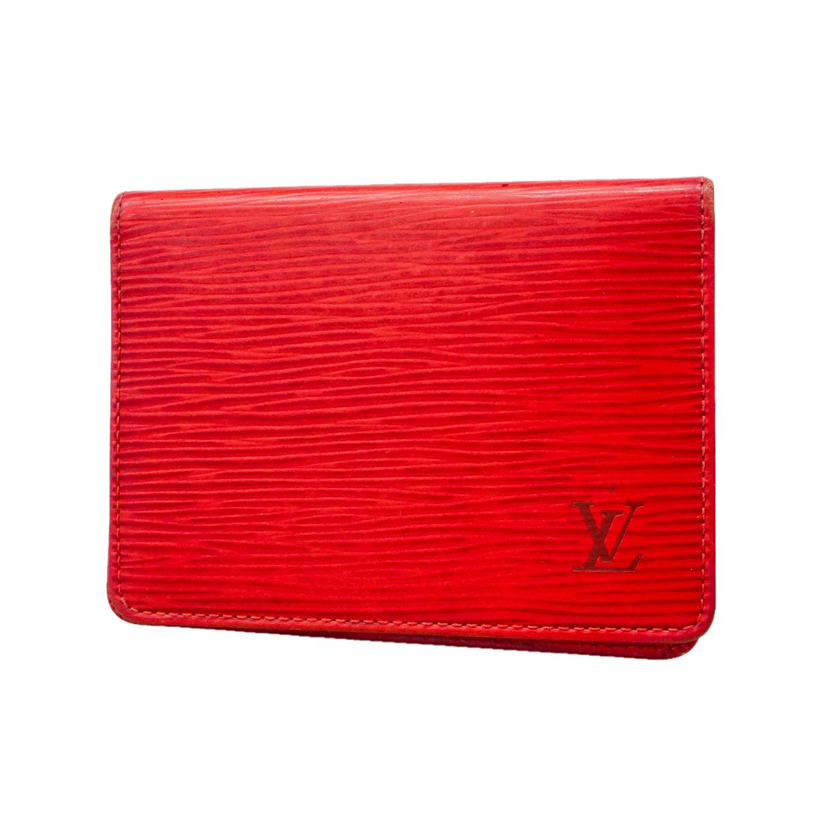Red Louis Vuitton Epi leather pass case front exterior showing the embossed LV logo.