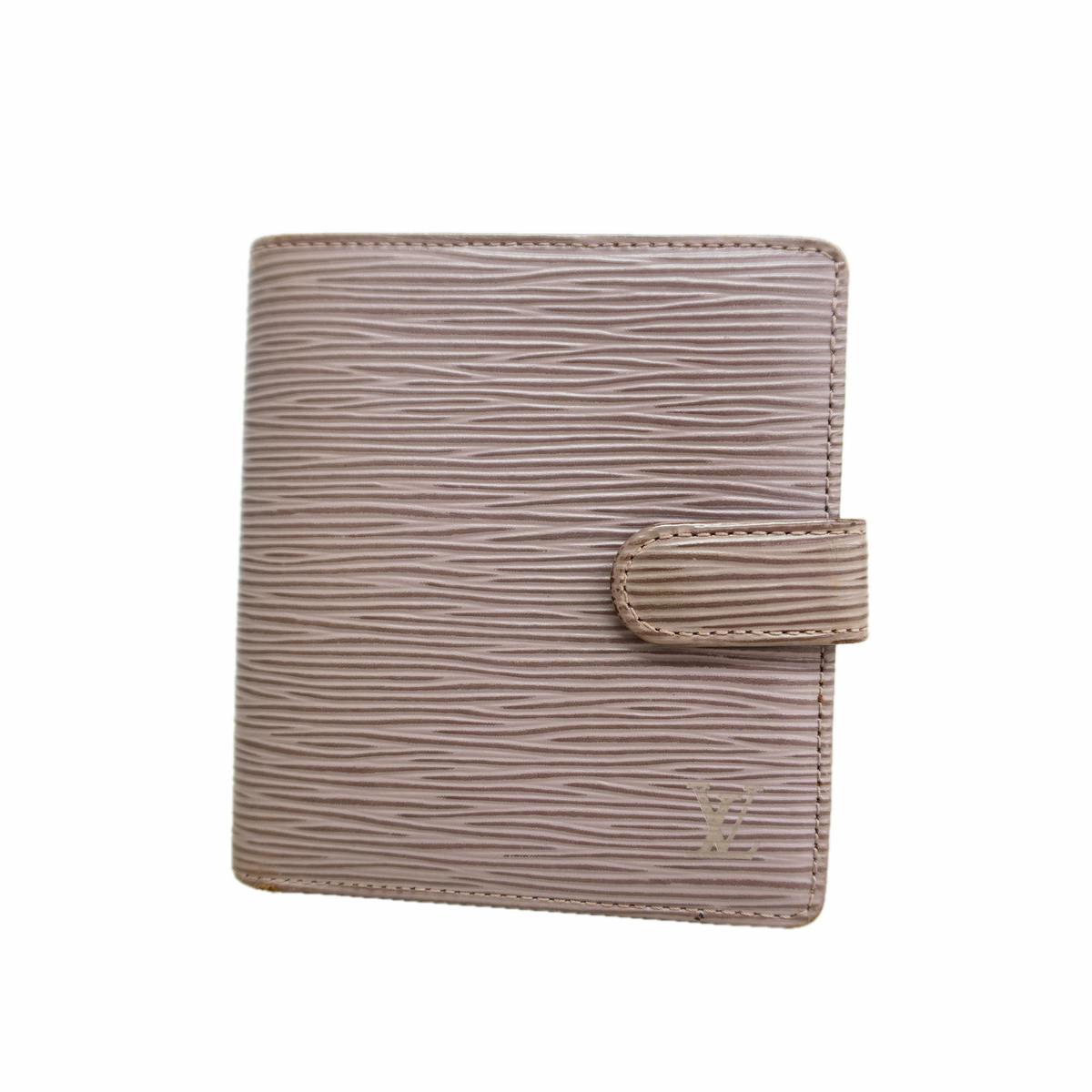Front view of a Louis Vuitton Epi Portefeuille Compact lilac cow leather wallet with textured wave pattern and tab closure.