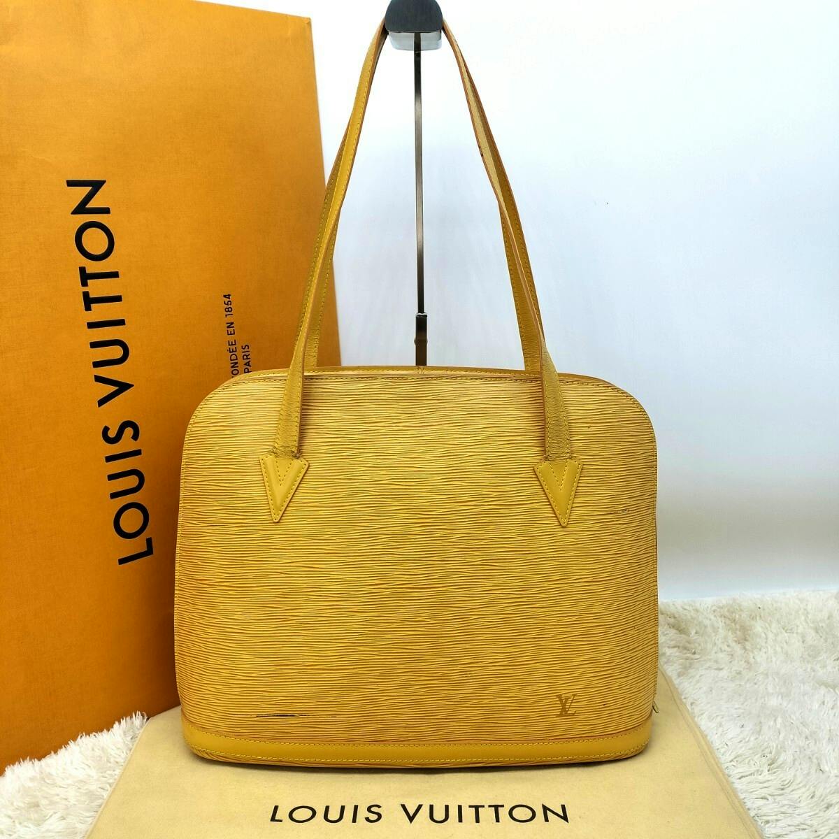 Front view of the yellow Louis Vuitton Epi leather shoulder/tote bag shown with a Louis Vuitton box and dust bag.