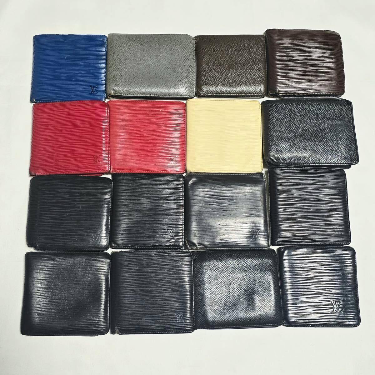 Sixteen Louis Vuitton wallets arranged in a 4x4 grid on a white background.