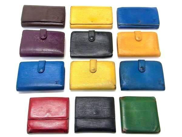 Twelve Louis Vuitton Epi leather wallets in various colors arranged in a grid on a white background.