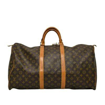 Louis Vuitton Monogram Keepall 55 duffel bag with leather handles and trim shown front view.