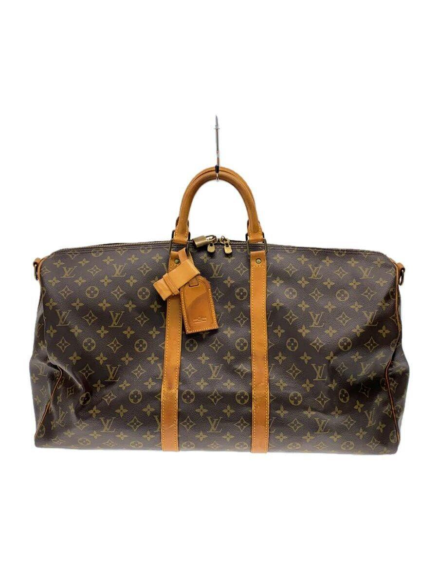 Front view of the Louis Vuitton キーポル55 monogram canvas bag with brown leather trim and top handles.