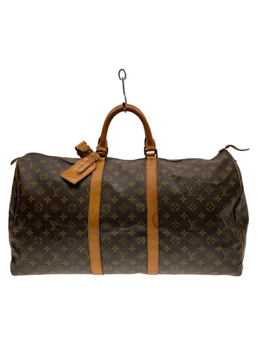 Louis Vuitton Keepall 60 monogram canvas duffle bag in brown with tan leather straps and handles shown front-on against a white background.