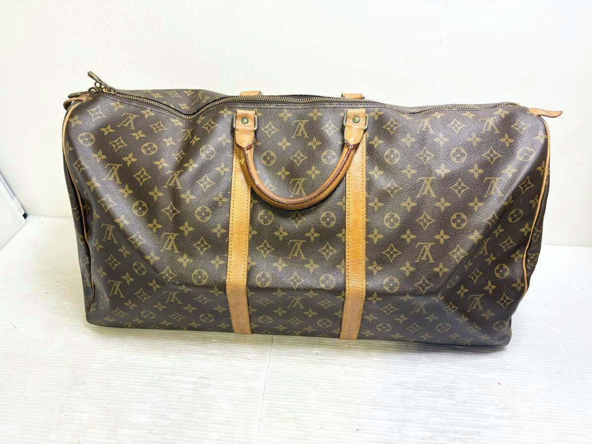 Front view of the Louis Vuitton Monogram キーポル60 canvas duffel bag showing monogram canvas and leather handles.