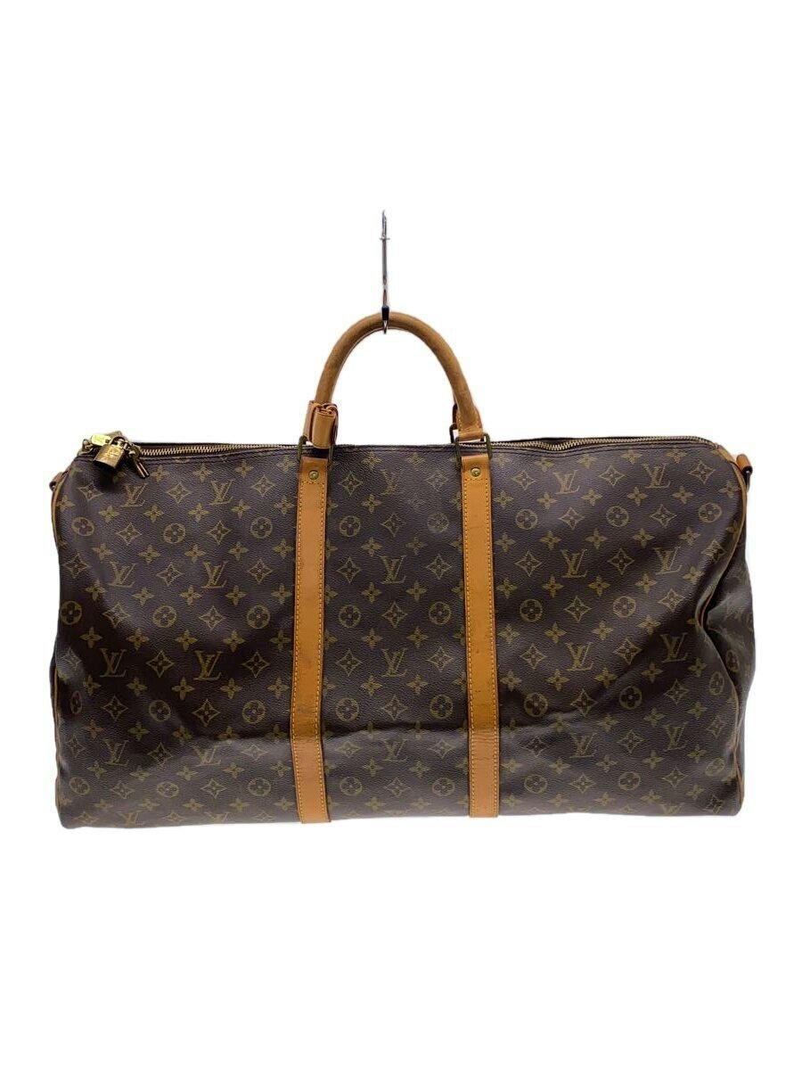 Front view of the Louis Vuitton monogram canvas Keepall duffle bag with brown leather handles and straps.