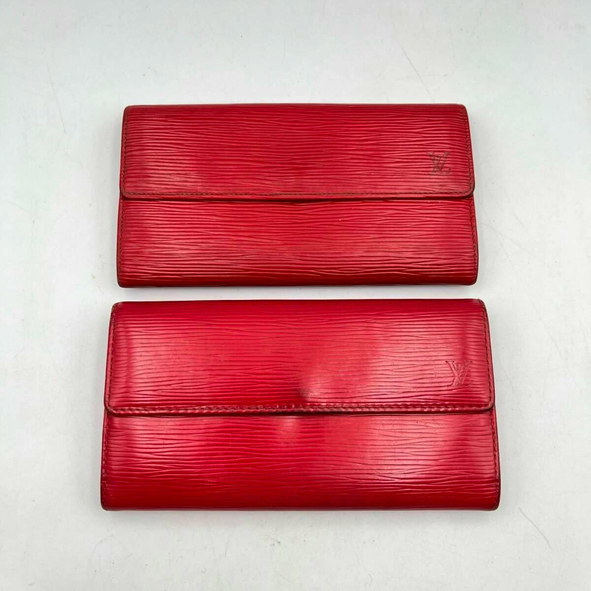 Two red Louis Vuitton long wallets shown flat on a white background, displaying the exterior fronts.