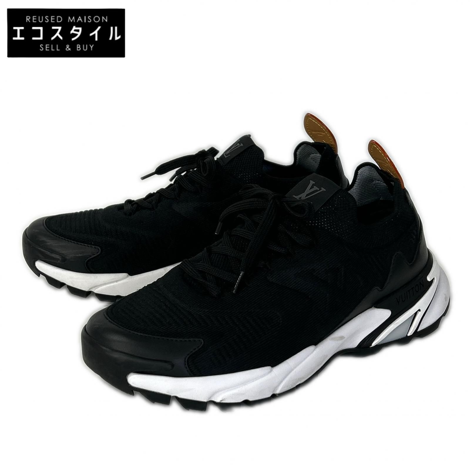 Pair of black LOUIS VUITTON Tatick knit sneakers (size 6 1/2) photographed on a white background.