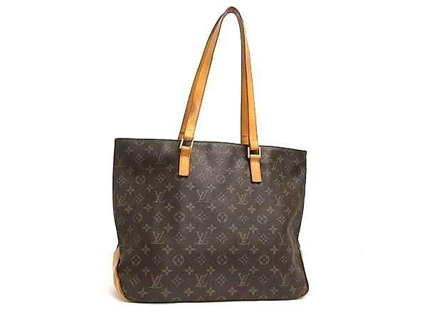 Front view of a brown Louis Vuitton Monogram tote/shoulder bag with tan leather straps.
