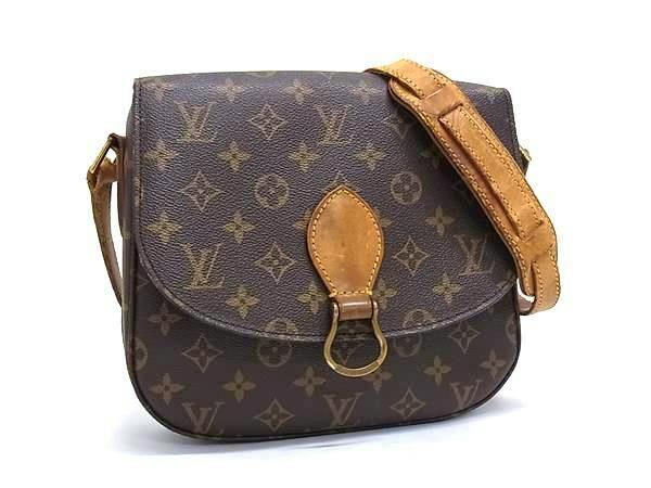 Front view of a Louis Vuitton Monogram Mini Saumur (M51244) brown crossbody shoulder bag with leather strap and flap closure.