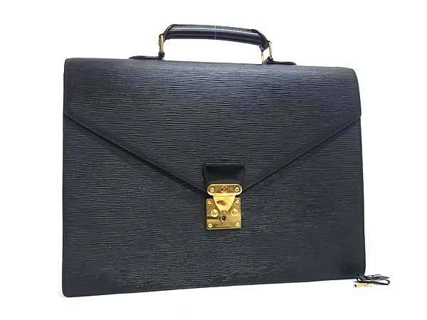 Front view of a black Louis Vuitton Epi Serviette Conseiller briefcase with a top handle and a gold-tone front lock on a white background.