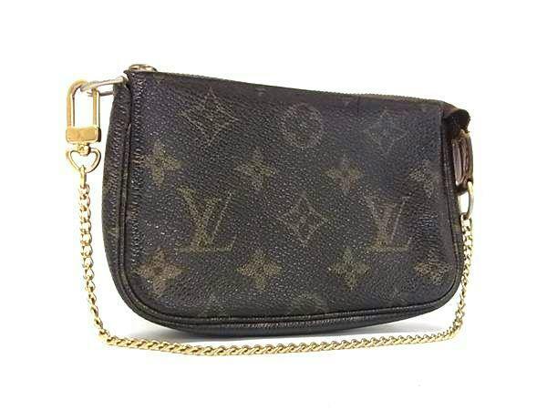 Brown Louis Vuitton Monogram mini pochette accessoires multi-pouch with gold chain on a white background.