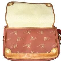 Open Louis Vuitton Calvi men's shoulder messenger bag with the flap lifted showing the interior lining and compartments.