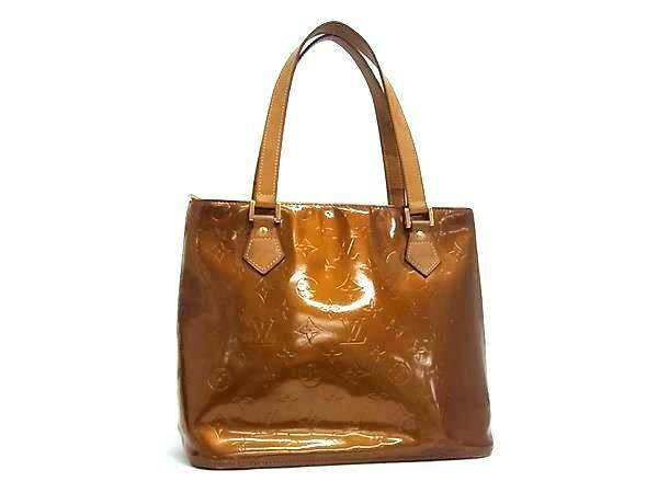 Front view of the Louis Vuitton Monogram Vernis Houston bronze-brown tote handbag with two shoulder straps on a white background.