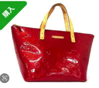 Red Louis Vuitton Monogram Vernis Bellevue PM tote bag with tan handles on a white background.