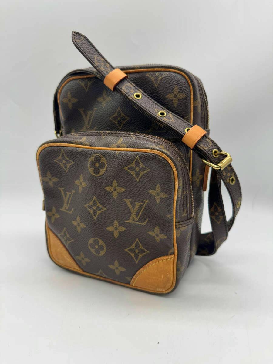 Front three-quarter view of the Louis Vuitton Monogram Amazon shoulder bag in canvas with leather trim and adjustable strap.