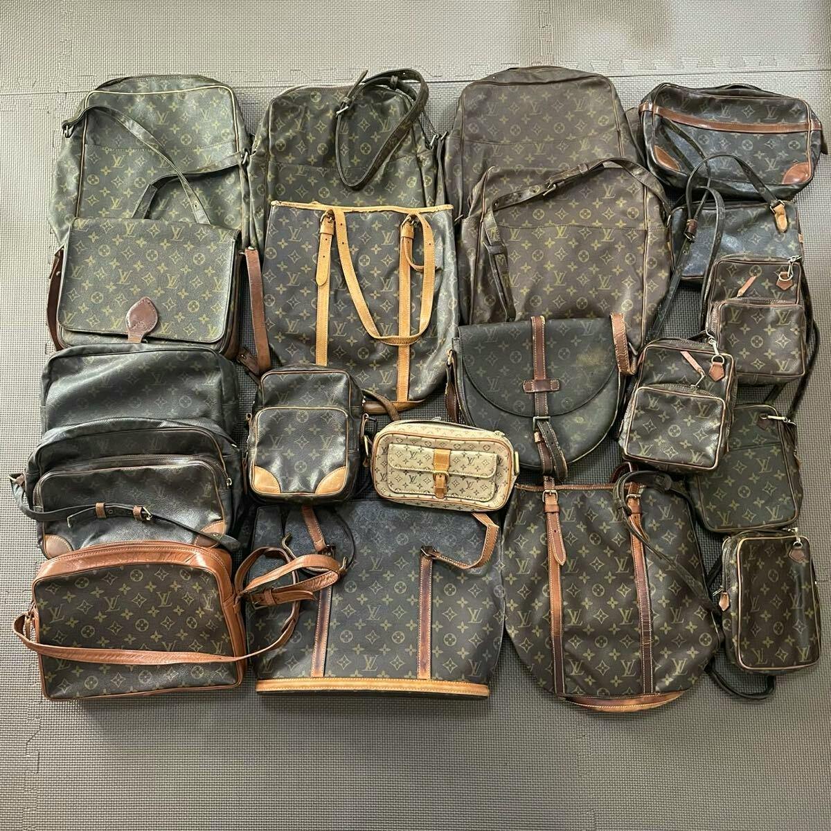 Multiple Louis Vuitton monogram canvas bags, pouches, and shoulder/tote bags arranged flat on a textured floor.