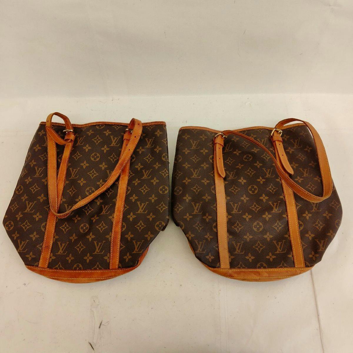Two Louis Vuitton monogram shoulder bags with leather straps and trim shown side by side on a white surface.