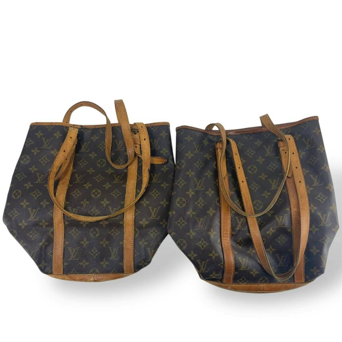 Two Louis Vuitton monogram bucket/tote bags with leather trim and shoulder straps on a white background.