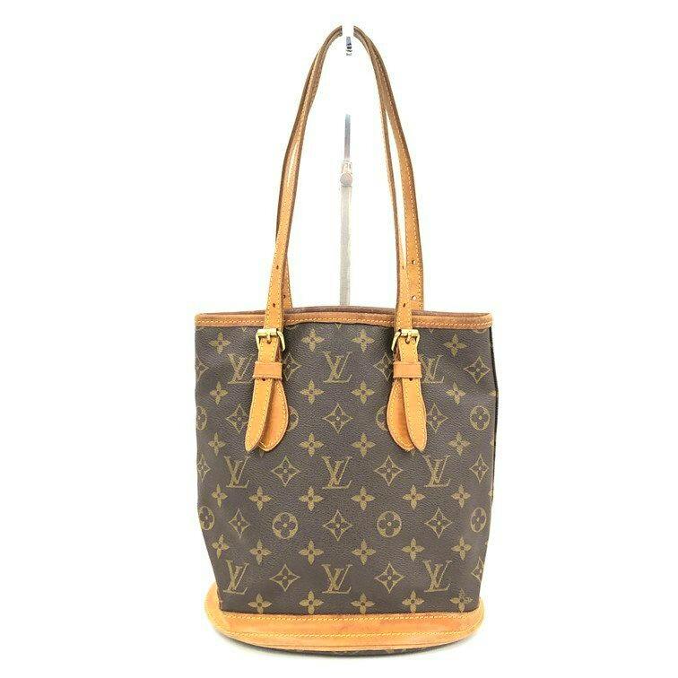 Front view of the Louis Vuitton Monogram Bucket PM tote bag showing monogram canvas with leather trim and shoulder straps.