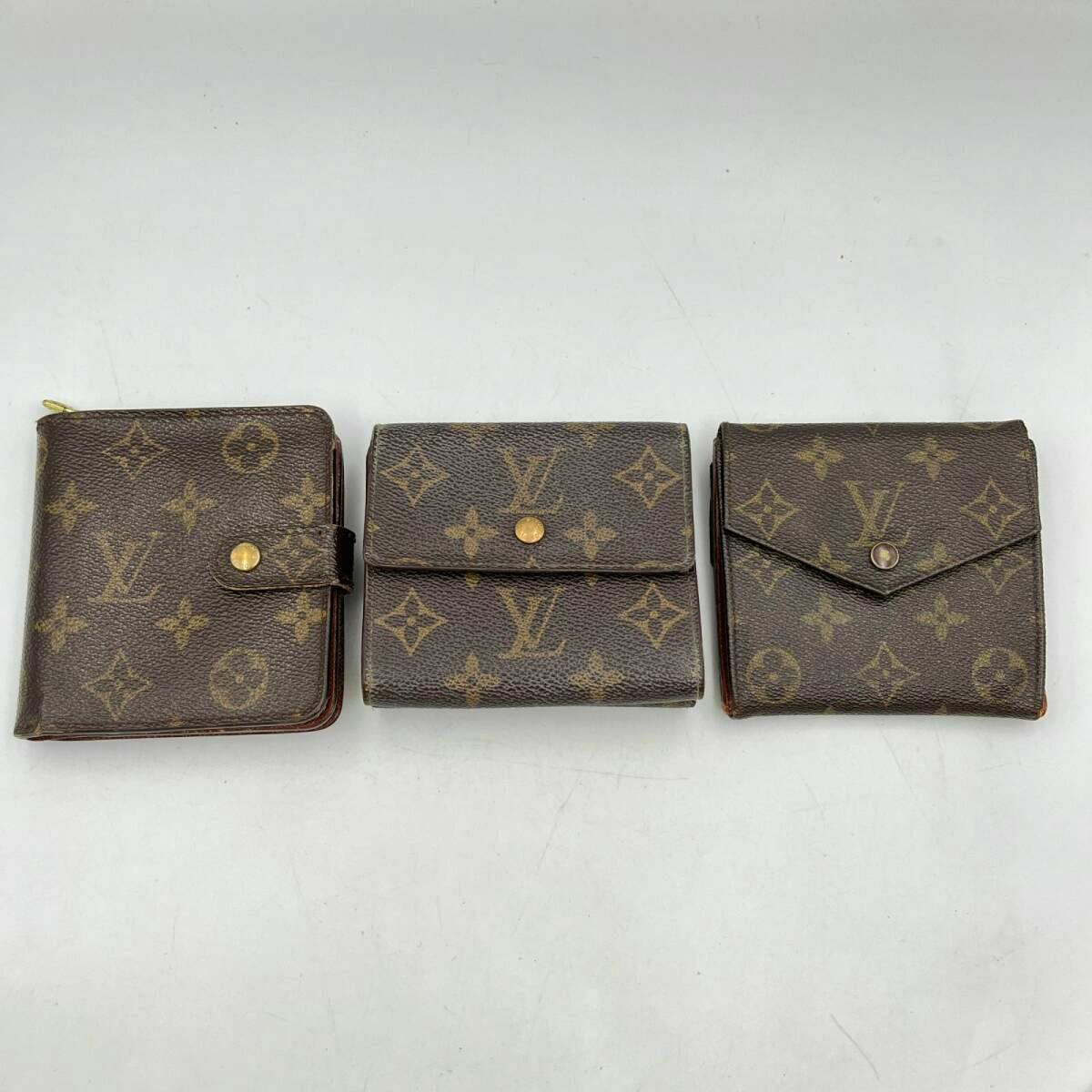 Three Louis Vuitton monogram canvas tri-fold mini wallets arranged side by side on a white background.