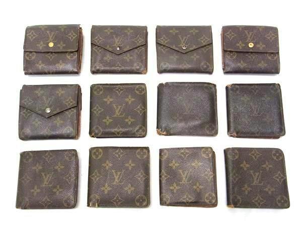Twelve LOUIS VUITTON monogram canvas wallets and coin purses arranged in rows on a white background.