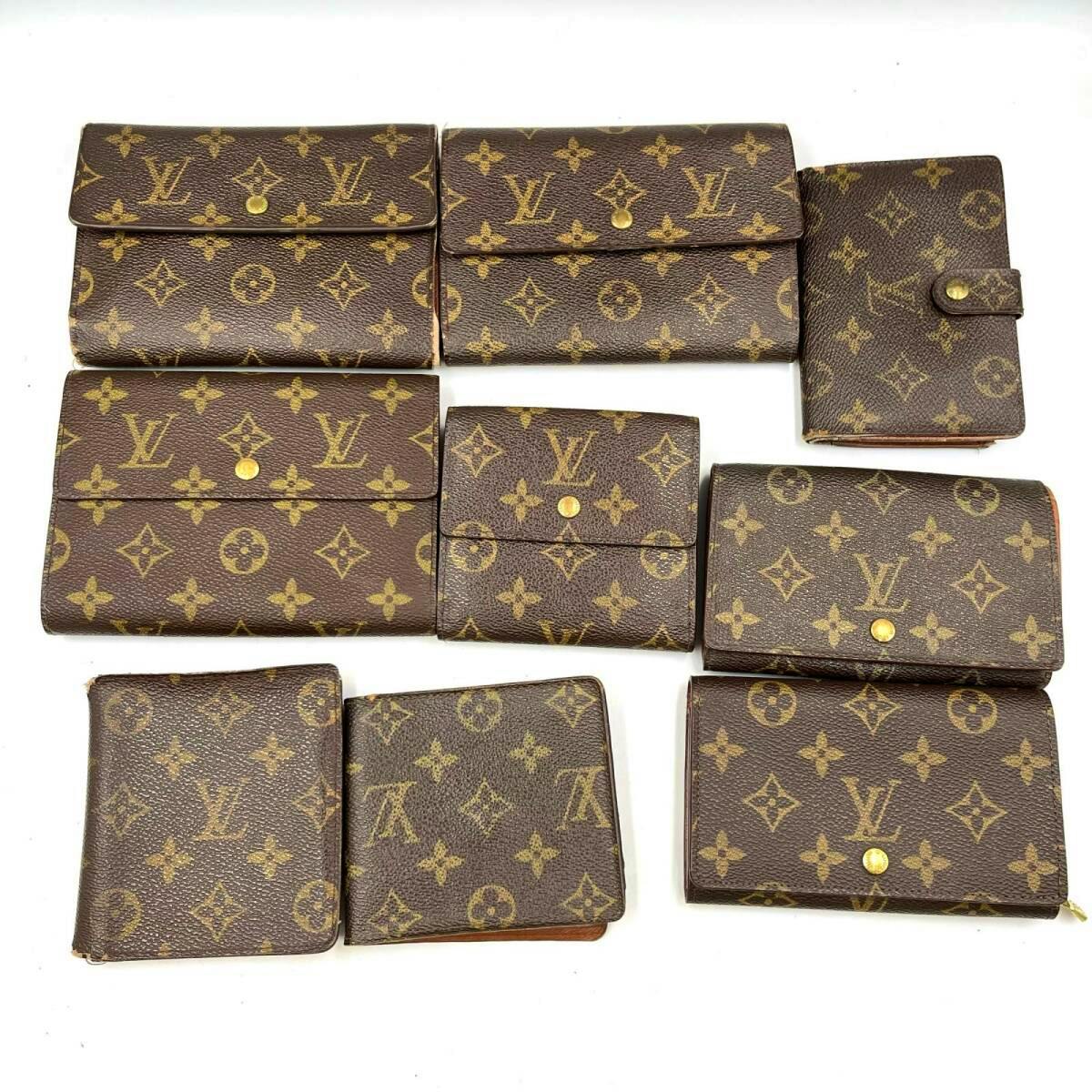 Nine Louis Vuitton monogram canvas wallets and small wallets arranged on a white background.
